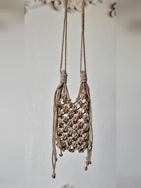  Ornate, handcrafted phone bag In two-tone.